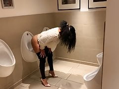 London girl uses urinal beside mens masterfulness
