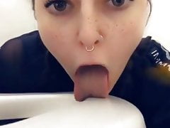 Girl licks the airplane toilet seat