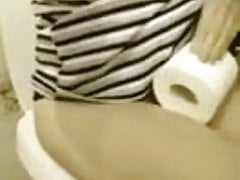 Girl films herself peeing